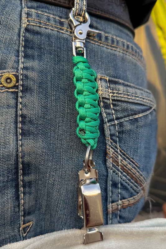 OLTX Emerald paracord glove clip in green attached to a belt loop