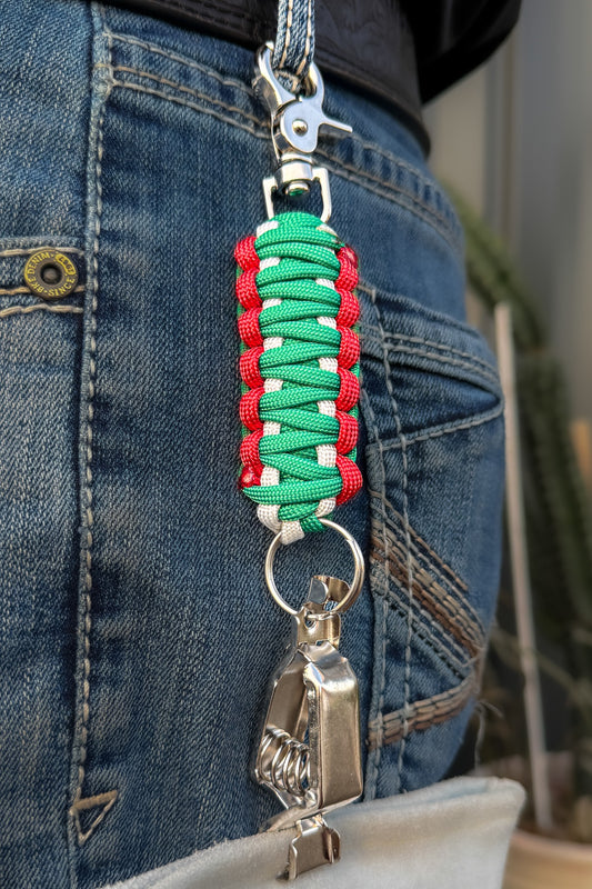OLTX México paracord glove clip in green / white / red attached to a belt loop