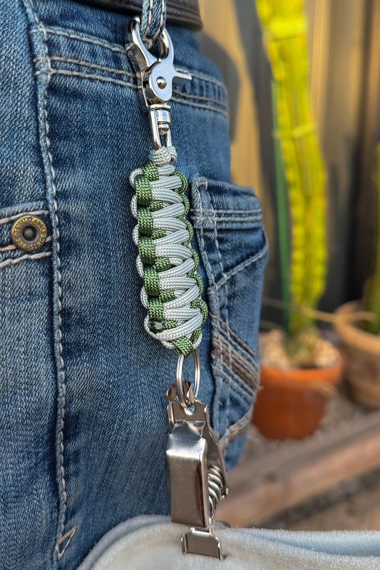 OLTX Ranger paracord glove clip in olive / light gray attached to a belt loop